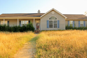 Vacant home with unmaintained landscape